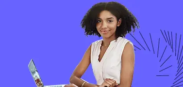 A lady holding a laptop on a blue background.
