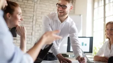People collaborating in a bright office space.