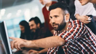 Group of people collaborating at computers