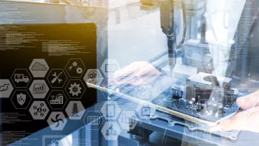 Technology and data with hands inspecting electronic components.