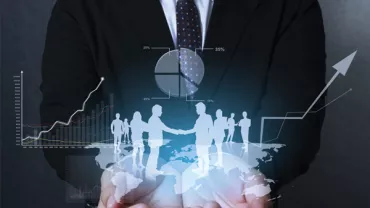 Person in suit with holographic business graphs and figures