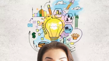 Person with doodles of a lightbulb and ideas overhead.
