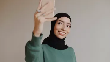 Person taking a selfie with a smartphone.