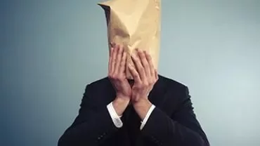 Individual with a paper bag over their head
