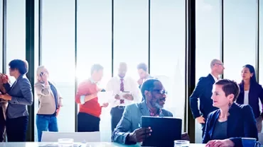 Business meeting in a bright office space.