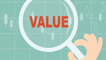 Magnifying glass with the word 'VALUE' on chart background.