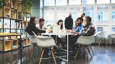 Group of people collaborating in a modern office space.