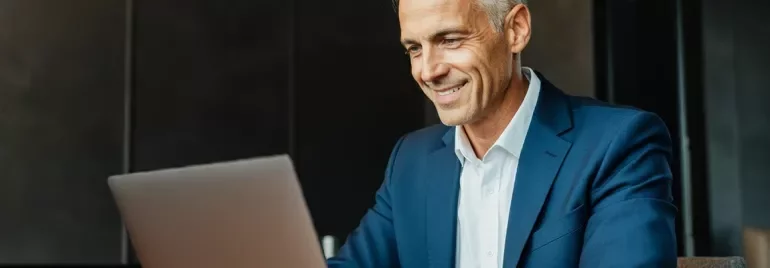 man checking references from his laptop