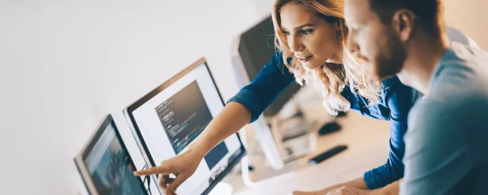 Two people collaborating at a computer