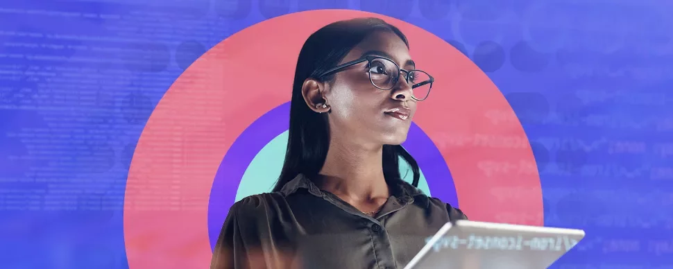 Person holding a tablet in front of colorful circles and digital codes