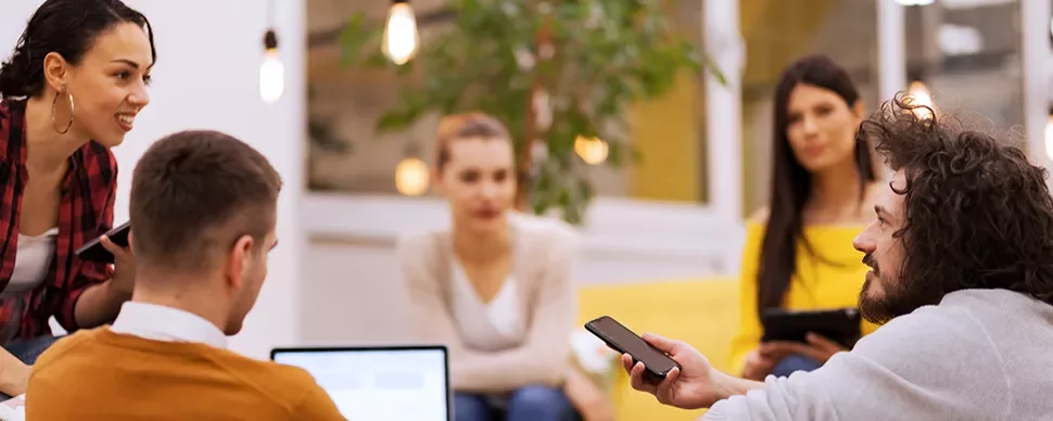 Group of people collaborating in a modern office space.