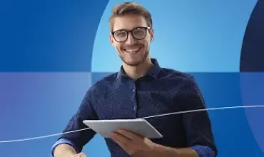 Promotional banner for Salary Guides 2026 featuring a smiling man on a blue background.