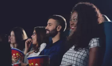 Group of people enjoying a movie at the cinema.