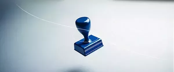 Een blauwe stempel met een grijze achtergrond.