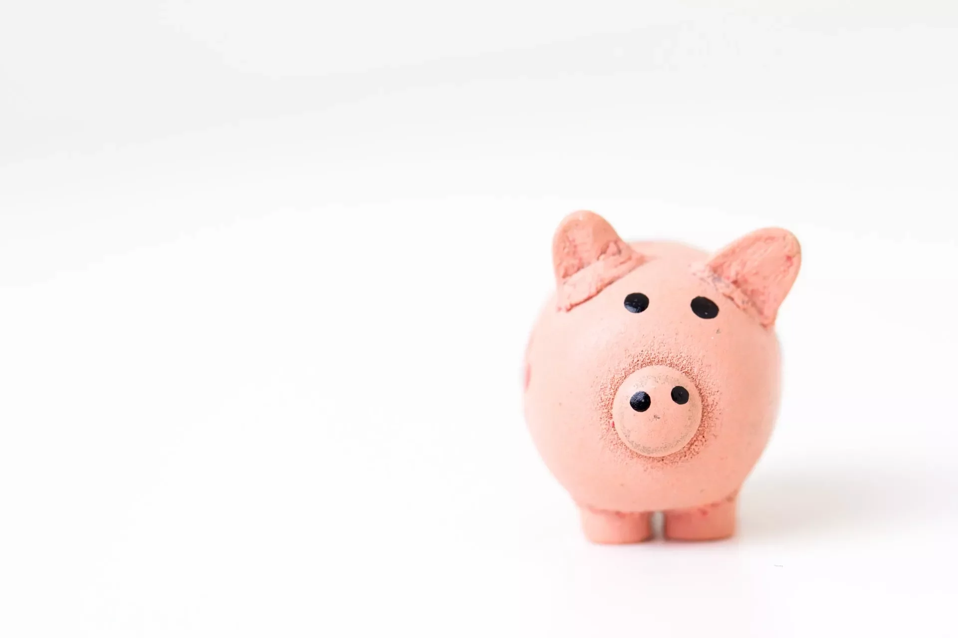 Colorful piggy bank on white background.